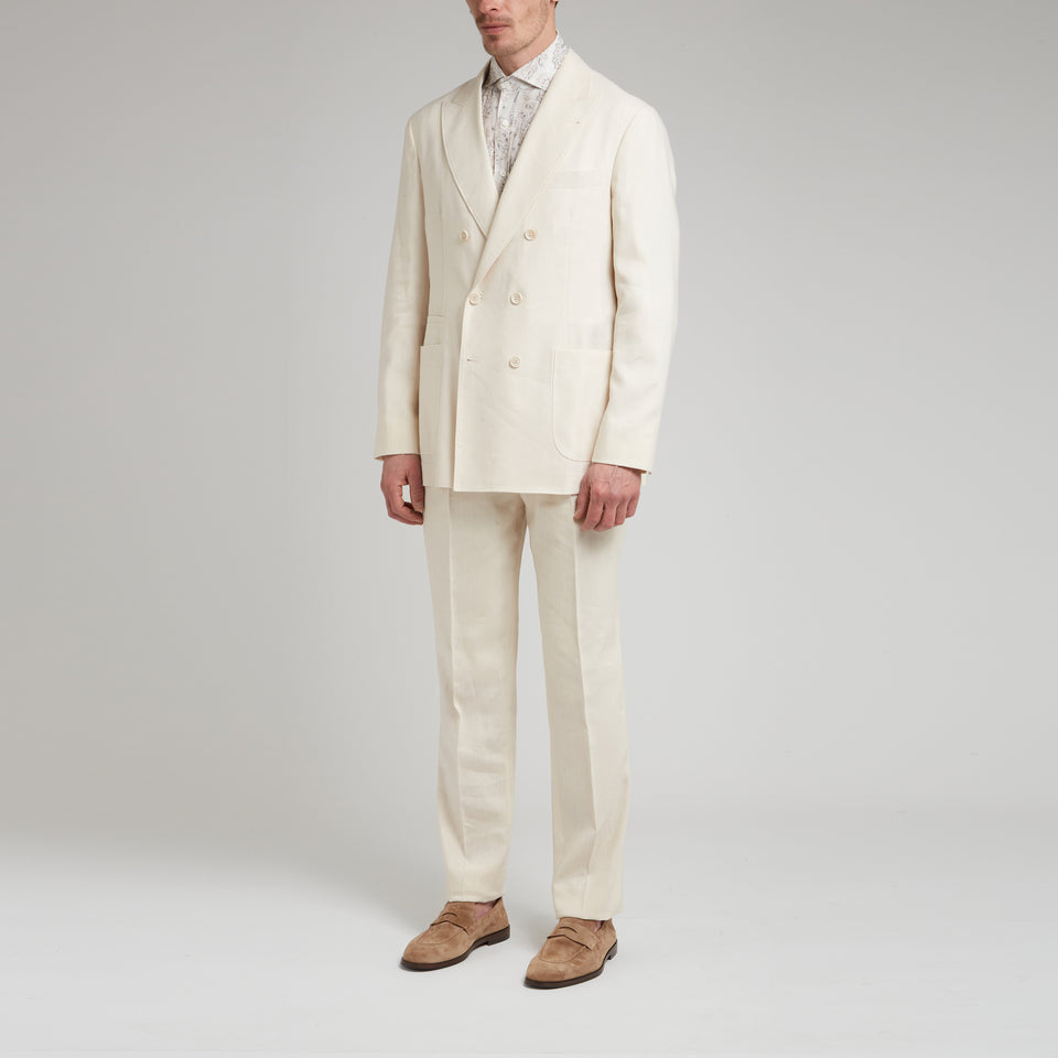 Double-breasted white linen suit