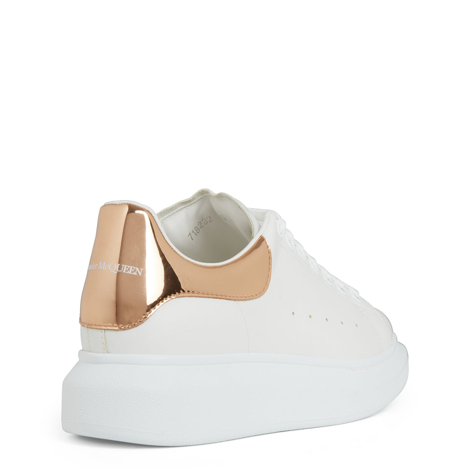 Oversized sneakers in white and gold leather