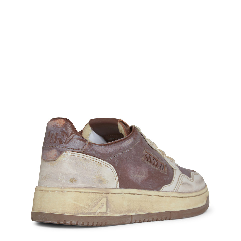 "Sup vint low" sneakers in white and brown leather