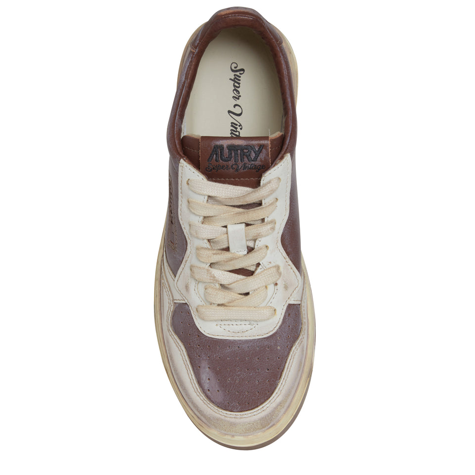 "Sup vint low" sneakers in white and brown leather