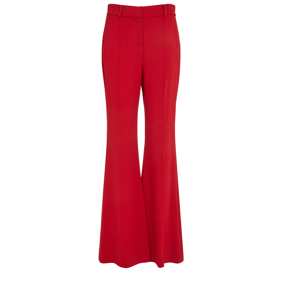 Flared tailored trousers in red fabric